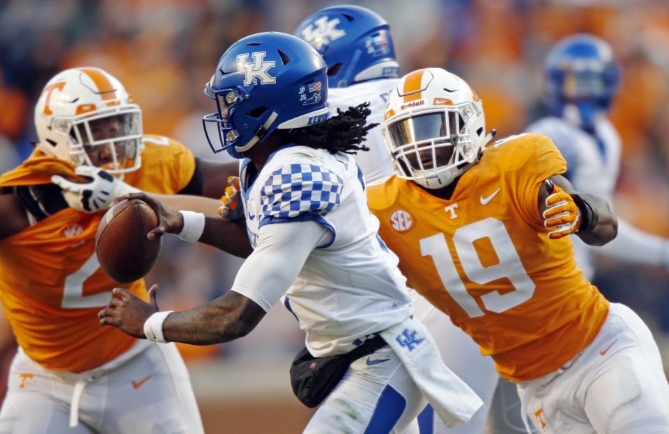 Kentucky quarterback Terry Wilson (3) is pressured by Tennessee linebacker Darrell Taylor (19) in the first half of an NCAA college football game Saturday, Nov. 10, 2018, in Knoxville, Tenn. Wilson was sacked on the play. (AP Photo/Wade Payne)