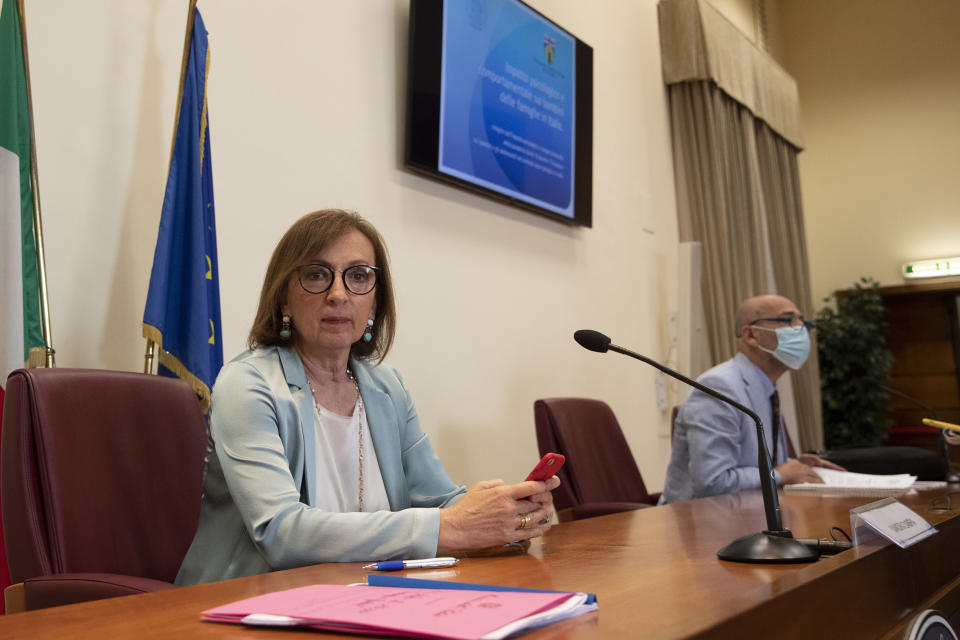 Sandra Zampa, Health Ministry Undersecretary, left, and psychiatrist Fabrizio Starace, sit at the start of a press conference at the Italian Health Ministry to present the results of an investigation on the psychological and behavioral impact the coronavirus lockdown has had on children and adolescents in Italy, in Rome, Tuesday, June 16, 2020. (AP Photo/Alessandra Tarantino)
