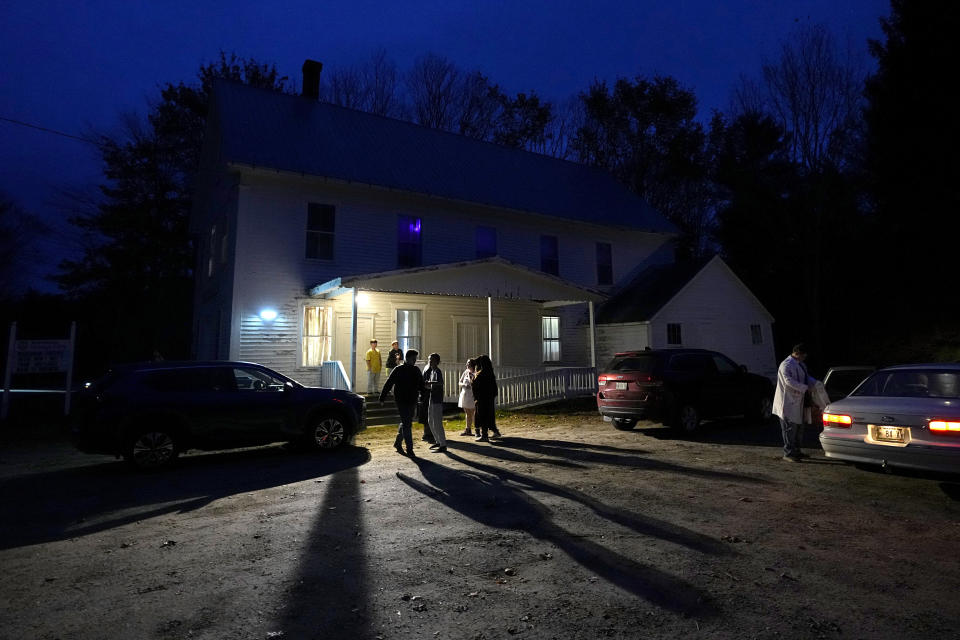 Teenagers who went to school with one of the shooting victims in Lewiston, Maine, gather at the Winthrop Grange Hall, Sunday, Oct. 29, 2023, in Winthrop, Maine. The small town of Winthrop, just northeast of Lewiston, is working to heal following the shooting deaths of 18 people at a bowling alley and a bar in Lewiston on Wednesday. (AP Photo/Matt York)