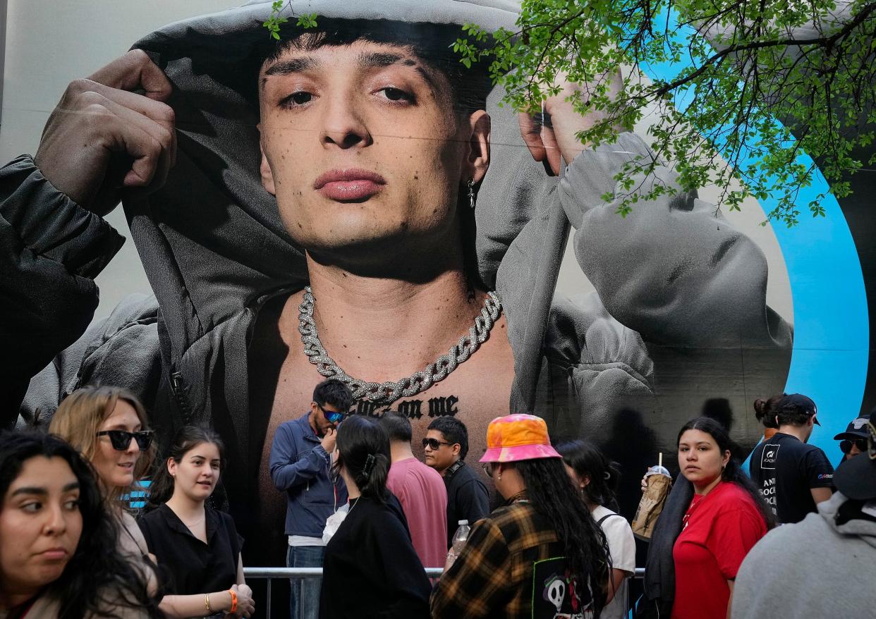 People wait in a line at ACL Live at Moody Theater for a performance by Mexican singer Peso Pluma at SXSW Wednesday March 13, 2024. At 4:30 p.m. the line wrapped around City Hall.