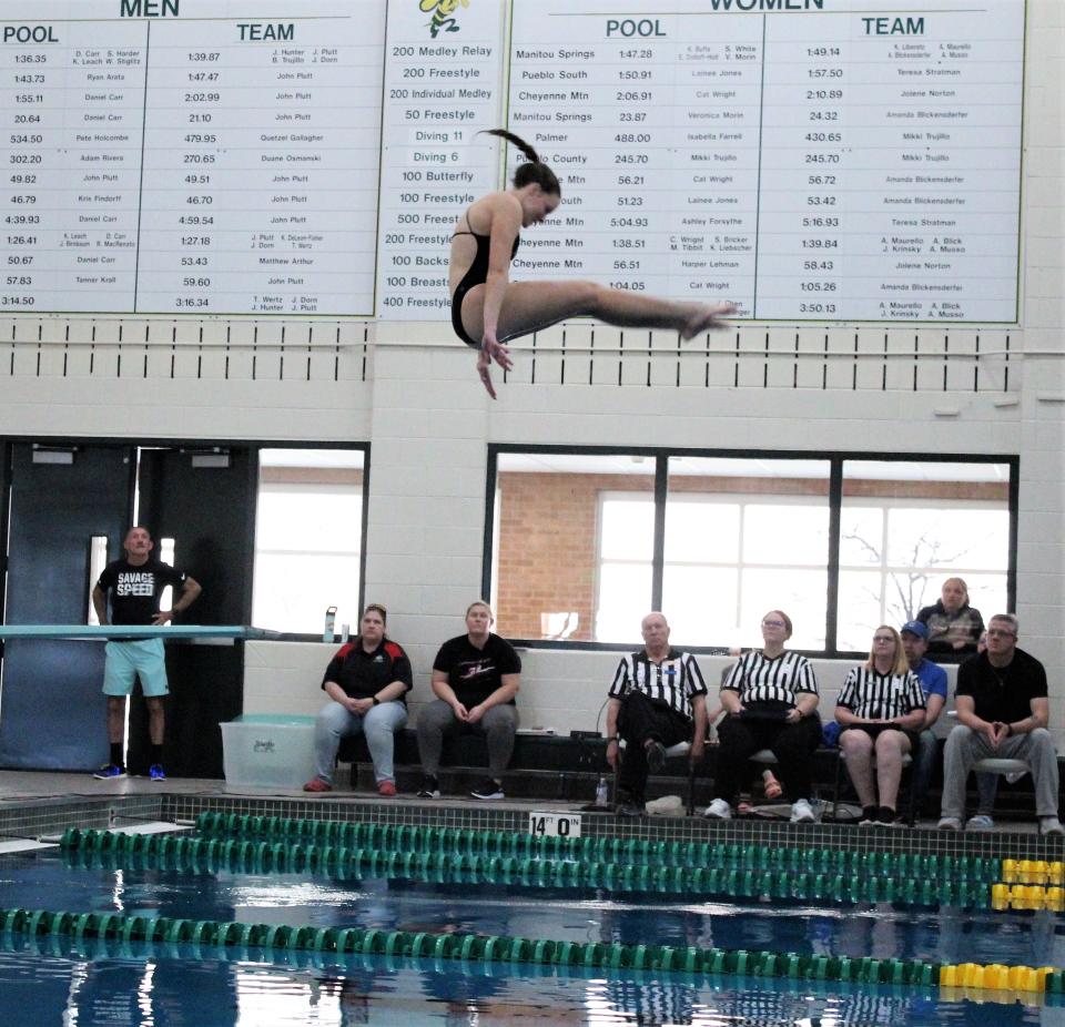 Kenzee Pfeifer of Pueblo West High School completes her dive at the South-Central League finals held Pueblo County High School on Feb. 4, 2023