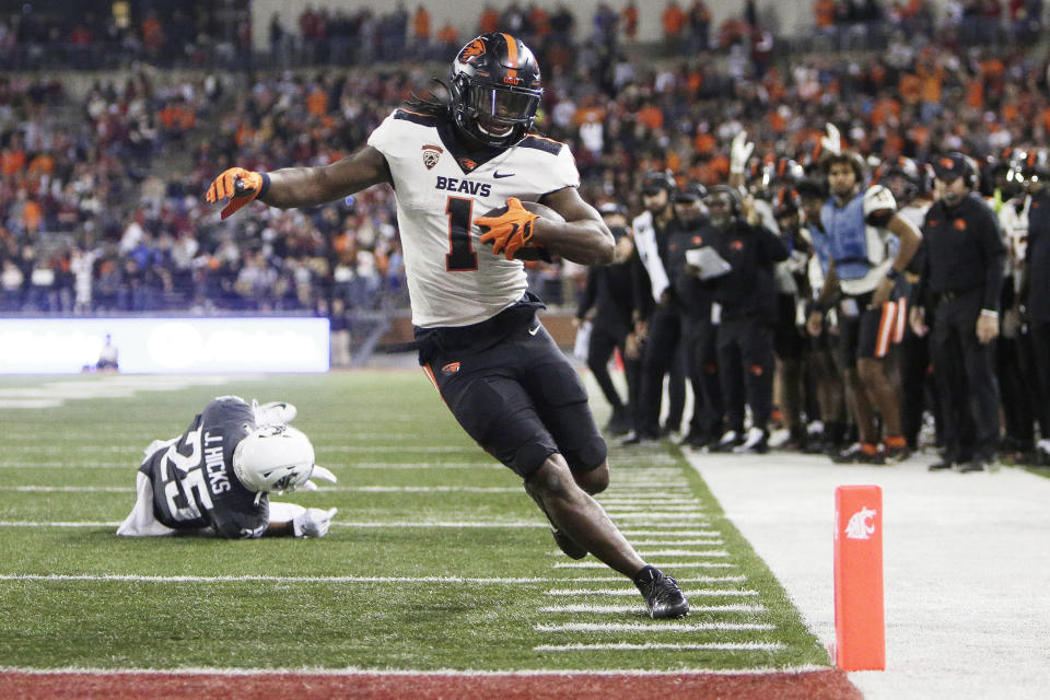 Oregon State running back Deshaun Fenwick (1) runs for a touchdown during the second half of an NCAA college football game against Washington State, Saturday, Sept. 23, 2023, in Pullman, Wash. Washington State won 38-35. (AP Photo/Young Kwak)