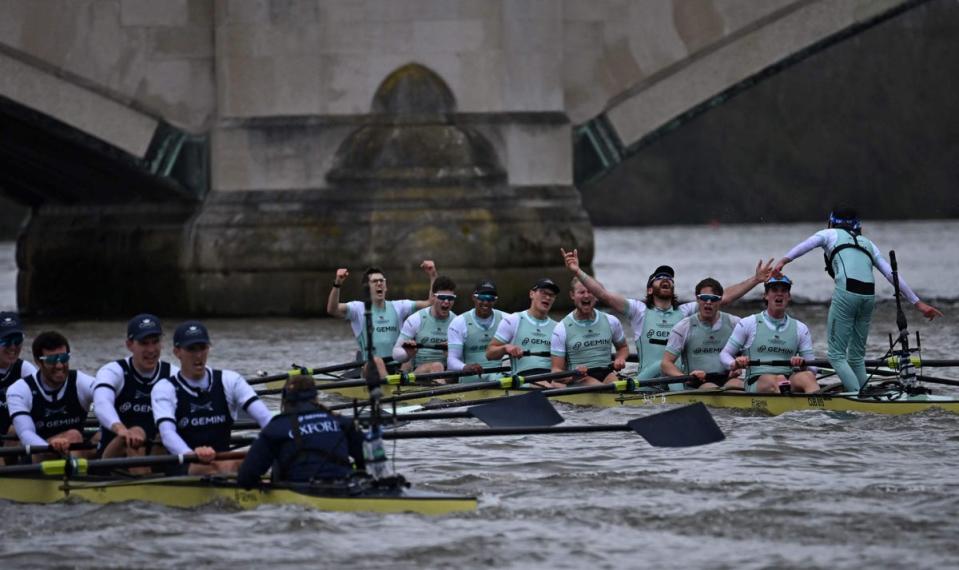 ROWING-GBR-BOAT RACE: The Cambridge crew (R) celebrate after their victory (AFP via Getty Images)