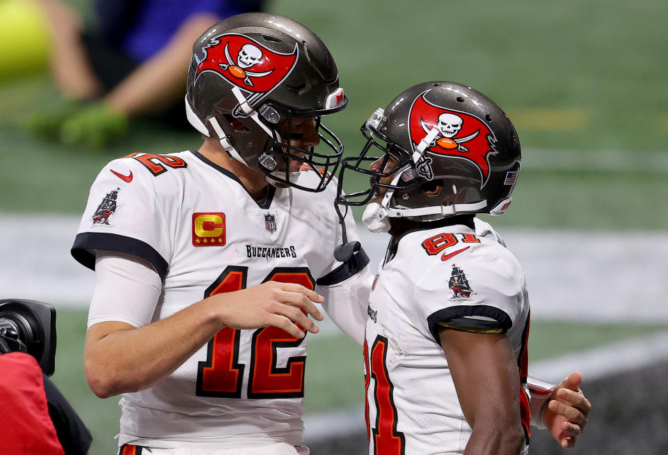 ATLANTA, GEORGIA - DECEMBER 20: Antonio Brown #81 of the Tampa Bay Buccaneers celebrates with Tom Brady #12 after scoring a 46 touchdown against the Atlanta Falcons during the fourth quarter in the game at Mercedes-Benz Stadium on December 20, 2020 in Atlanta, Georgia. (Photo by Kevin C. Cox/Getty Images)