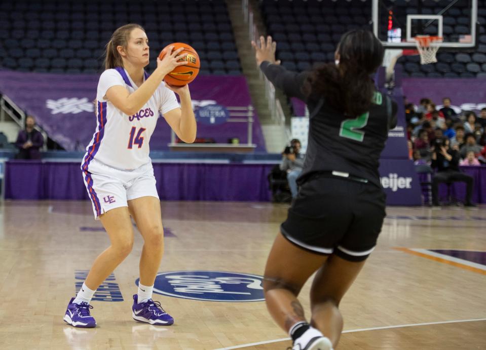 Evansville’s Abby Feit (14) takes a three-point shot as the University of Evansville Purple Aces play the Chicago State Cougars at Ford Center in Downtown Evansville, Ind., Wednesday afternoon, Nov. 16, 2022. 