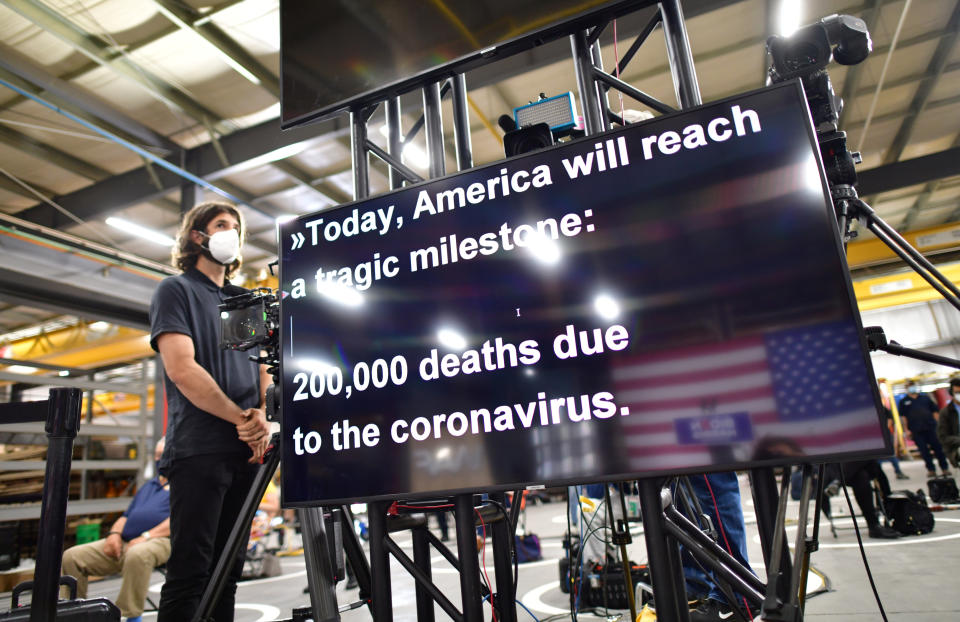 Joe Biden's teleprompter refers to the death toll from the coronavirus disease (COVID-19) outbreak in the United States exceeding 200,000 people as he speaks during a campaign event at the Wisconsin Aluminum Foundry in Manitowoc, Wisconsin, U.S., September 21, 2020.  (Mark Makela/Reuters)