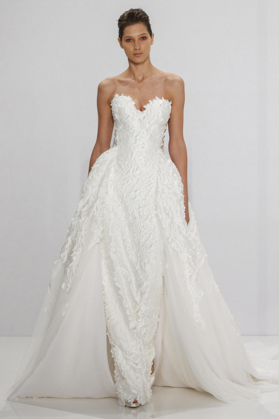 <p>A model wears a gown from the Mark Zunino i for Kleinfeld fall-winter 2017 bridal collection.</p><p><i>(Photo: Courtesy of Mark Zunino for Kleinfeld)</i></p>