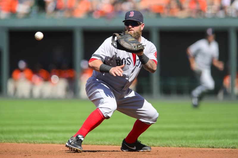 Boston Red Sox first baseman Napoli fields a ground ball off the bat of Baltimore Orioles batter Clevenger during the second inning of their MLB American League baseball game in Baltimore