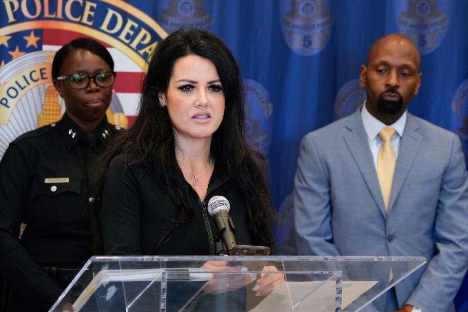 Sandy DeLaMora, the widow of Jose Quezada, speaks at a news conference where Los Angeles police detectives announced the arrest of two suspects in connection with Quezada's murder. He was shot and killed after volunteering at a community event on July 27, 2023.