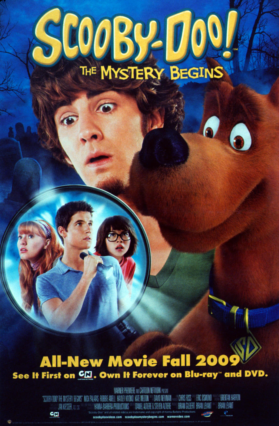 Scooby-Doo movie poster featuring Fred Jones, Daphne Blake, Velma Dinkley, and Shaggy Rogers looking surprised, promoting "The Mystery Begins" for Fall 2009