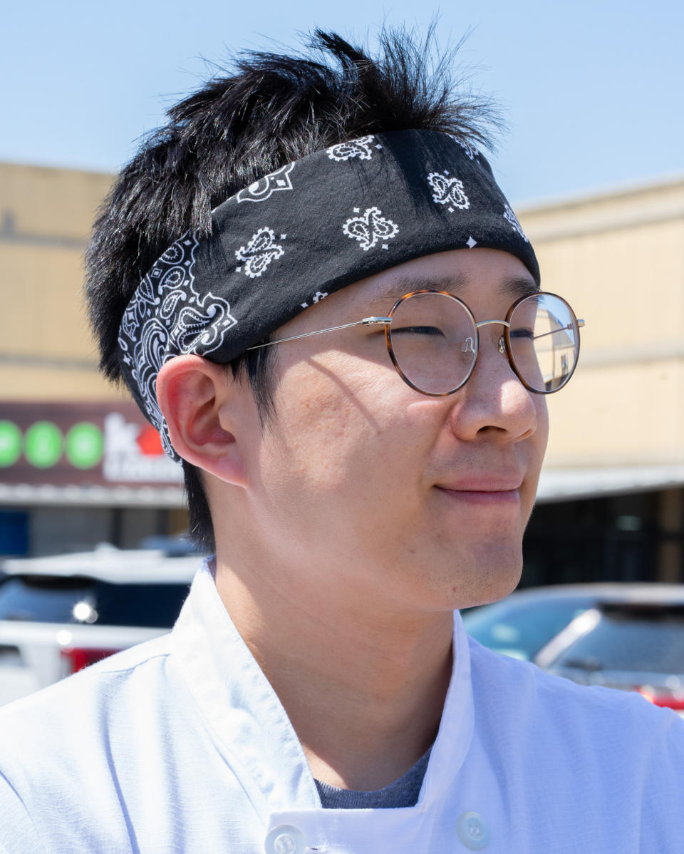 Tom Ye is a cook in his 20s at a nearby restaurant at Asiana Plaza. (Raul Rodriguez for NBC News)