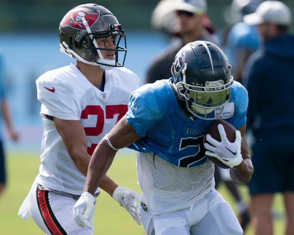 Tennessee Titans wide receiver Robert Woods (2) races up the field with a catch past Tampa Bay Buccaneers cornerback Zyon McCollum (27) during a joint training camp practice at Ascension Saint Thomas Sports Park Wednesday, Aug. 17, 2022, in Nashville, Tenn. 