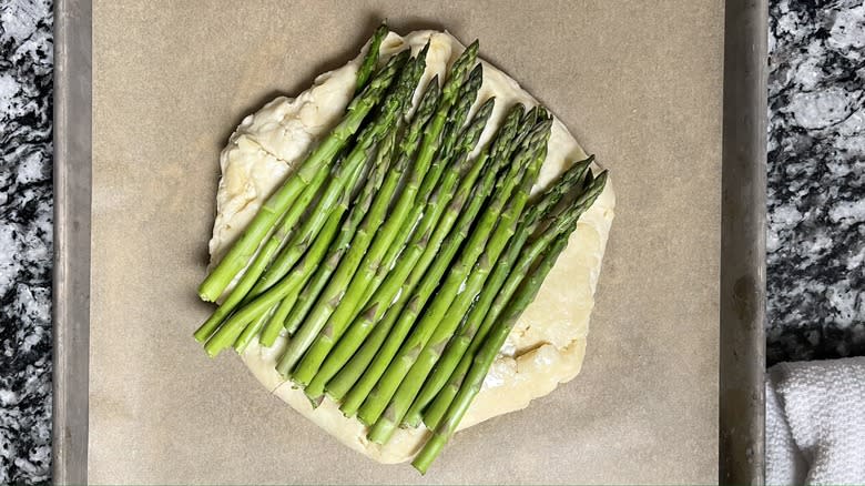 unbaked asparagus galette on pan