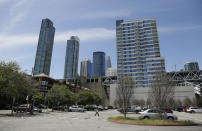 In this photo taken Thursday, April 18, 2019, is the proposed site of a waterfront homeless shelter that is currently a parking lot in San Francisco. The city of San Francisco, which has too little housing and too many homeless people sleeping in the streets, is teeming with anxiety and vitriol these days. A large new homeless shelter is on track to go up along a scenic waterfront area dotted with high-rise luxury condos, prompting outrage from some residents. (AP Photo/Eric Risberg)