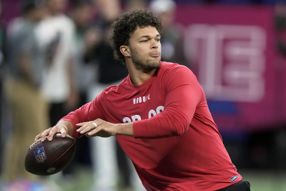 FILE - BYU quarterback Jaren Hall runs a drill at the NFL football scouting combine in Indianapolis, Saturday, March 4, 2023. In the first nine drafts after former sixth-round pick Tom Brady won his first Super Bowl following the 2002 season, there were an average of seven QBs taken in the final three rounds of the draft. (AP Photo/Michael Conroy, File)