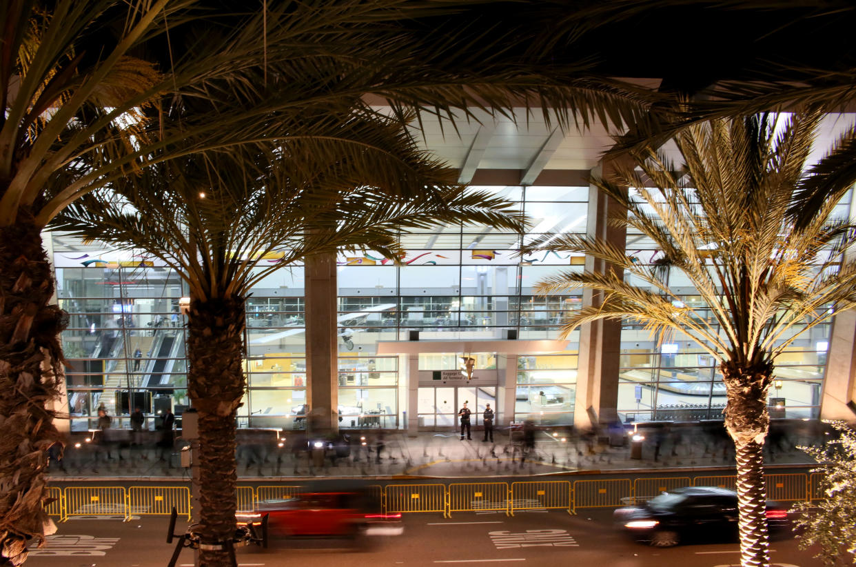 In this long time exposure photo, protesters march during a rally against the travel ban at San Diego International Airport on March 6, 2017 in San Diego, California.   US President Donald Trump signed a revised ban on refugees and on travelers from six Muslim-majority nations, scaling back the order to exempt Iraqis and permanent US residents. / AFP PHOTO / Sandy Huffaker        (Photo credit should read SANDY HUFFAKER/AFP/Getty Images)