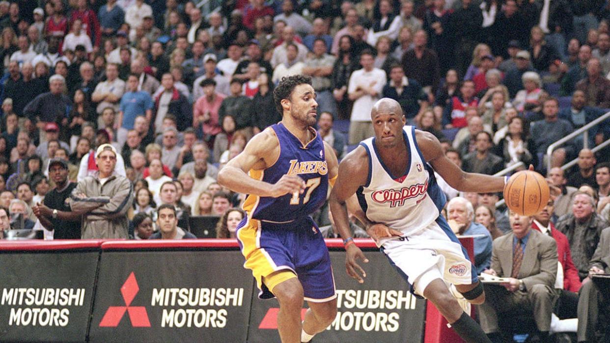 <div>Lamar Odom #7 of the Los Angeles Clippers rushes the basket against Rick Fox #17 of the Los Angeles Lakers. (Credit: Matt Kincaid /Allsport)</div> <strong>(Getty Images)</strong>