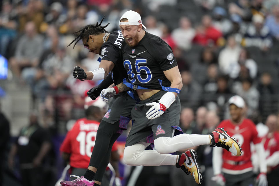 NFC tight end George Kittle (85) of the San Francisco 49ers celebrates a touchdown with NFC wide receiver Justin Jefferson of the Minnesota Vikings during the flag football event at the NFL Pro Bowl against the AFC, Sunday, Feb. 5, 2023, in Las Vegas. (AP Photo/John Locher)