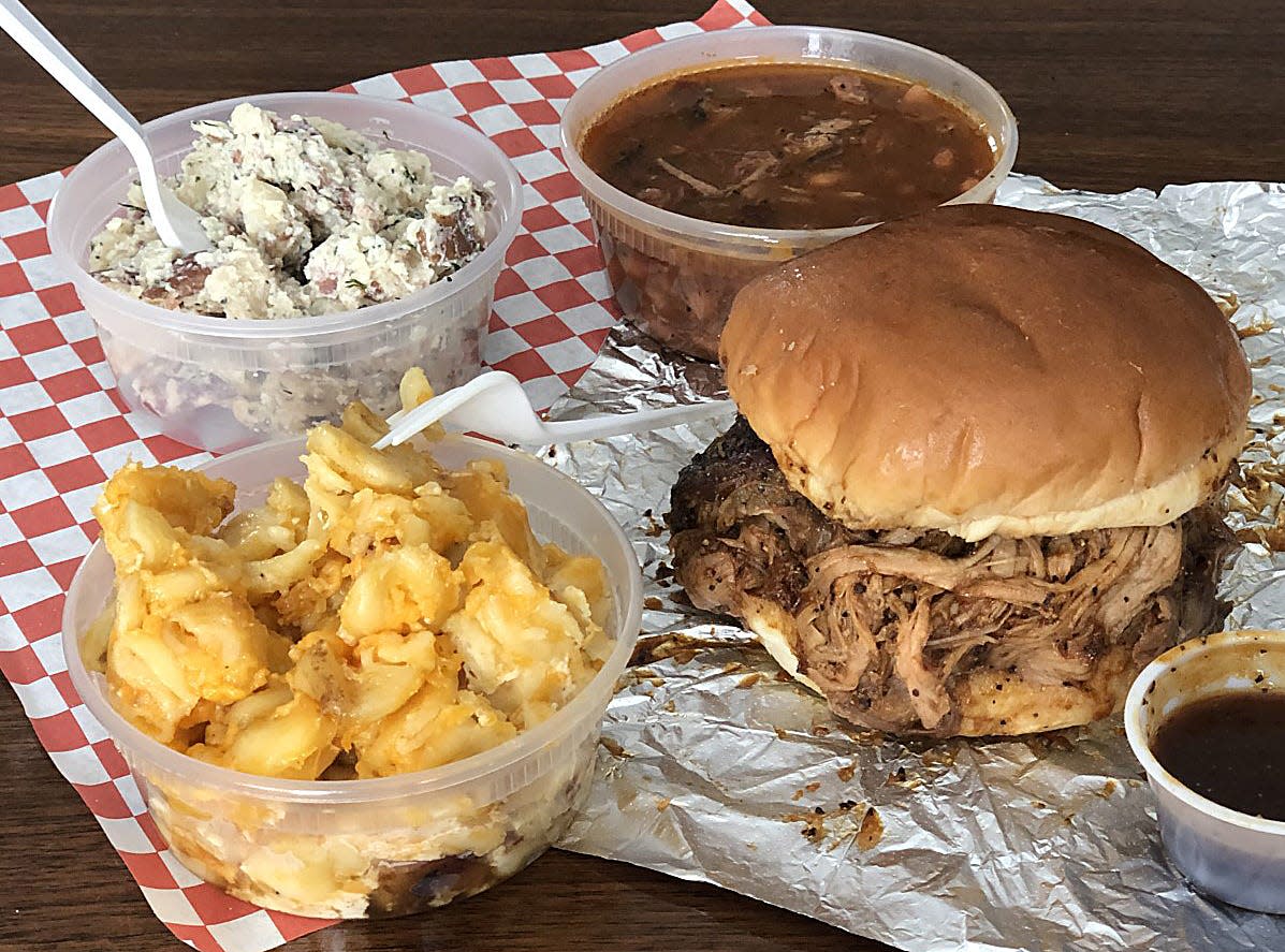 Some of the features at Joe's Barbecue include sides of mac n cheese, buttermilk potato salad, charro beans, and a pulled pork sandwich on Sunday, Feb. 14, 2021 in Brimfield, Ohio. [Phil Masturzo/ Beacon Journal]