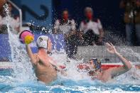 <p>Spain's Miguel de Toro Dominguez (R) vies with USA's Hannes Daube during the Tokyo 2020 Olympic Games men's water polo quarter-final match between the USA and Spain at the Tatsumi Water Polo Centre in Tokyo on August 4, 2021. (Photo by Angela WEISS / AFP)</p> 