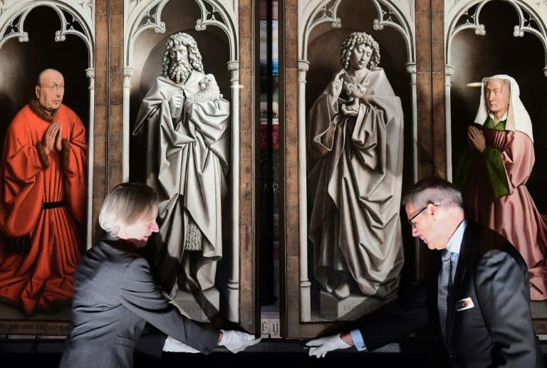 After years of restoration officials unveil the restored panels of the 1432 artwork "The Adoration of the Mystic Lamb" by the Van Eyck brothers