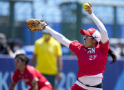 Japan's Miu Goto pitches during the softball game between Japan and Australia at the 2020 Summer Olympics, Wednesday, July 21, 2021, in Fukushima, Japan. (AP Photo/Jae C. Hong)