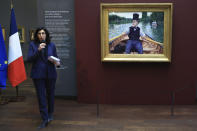 French Culture Minister Rima Abdul-Malaki speaks beside "A Boating Party" by French painter Gustave Caillebotte at the Orsay Museum, Monday, Jan. 30, 2023 in Paris. France has acquired a stunning Impressionist masterpiece for its national collection of art treasures, with luxury goods giant LVMH helping to pay 43-million euros (nearly $47 million) for "A Boating Party" by 19th century French artist Gustave Caillebotte. (AP Photo/Aurelien Morissard)