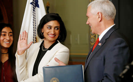 FILE PHOTO: U.S. Vice President Mike Pence swears in Seema Verma as the administrator of the Centers for Medicare and Medicaid Services in Washington, U.S., March 14, 2017, as daughter Maya stands at her side. REUTERS/Kevin Lamarque/File Photo