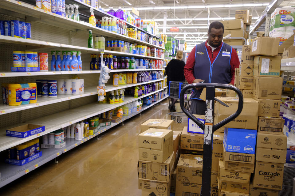 BLOOMINGTON, UNITED STATES - MARCH 11, 2020: A Wal Mart worker restocks shelves after some were emptied by panic buyers on the day World Health Organization declared Coronavirus to be a pandemic. Toilet paper, wipes, protective breathing masks, and other items are either sold out at local stores, or are in short supply.- PHOTOGRAPH BY Jeremy Hogan / Echoes Wire/ Barcroft Studios / Future Publishing (Photo credit should read Jeremy Hogan / Echoes Wire/Barcroft Media via Getty Images)