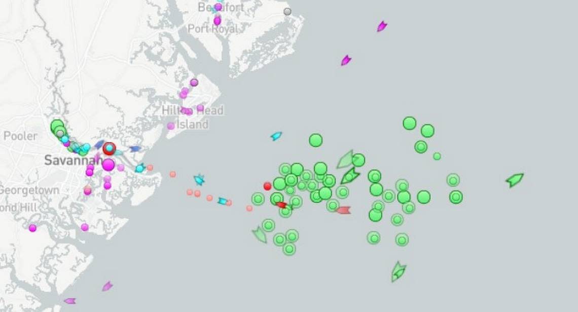 Green circles show anchored cargo ships and green arrows show moving ships off the coast of Hilton Head Island on Wednesday.