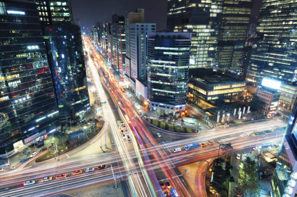 Night traffic speeds through the Gangnam district of Seoul, South Korea.