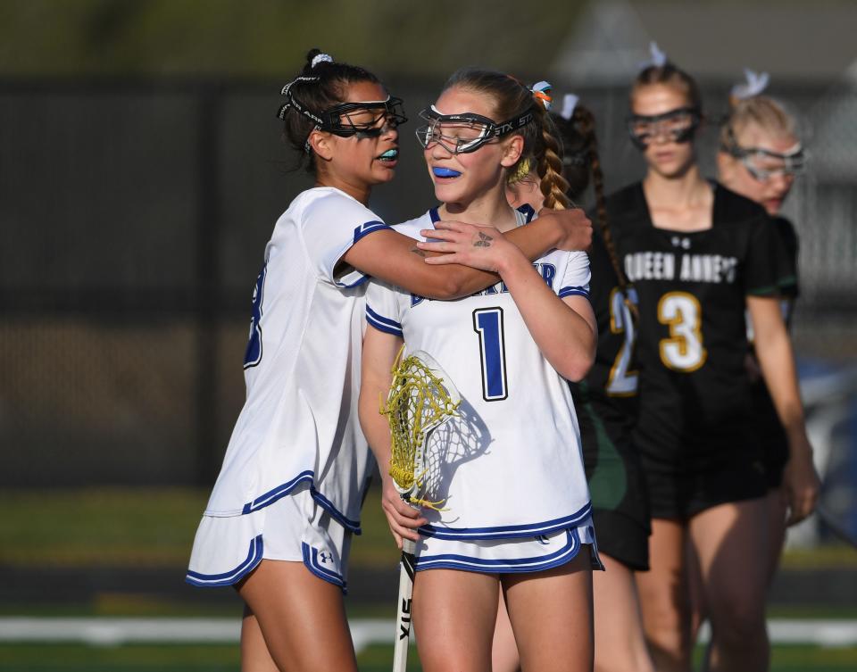 Decatur's MB Morse (8) and Caitlin Shimko (1) celebrate a goal against Queen Anne's Tuesday, April 16, 2024, in Berlin, Maryland. Decatur defeated Queen Anne's 10-7.