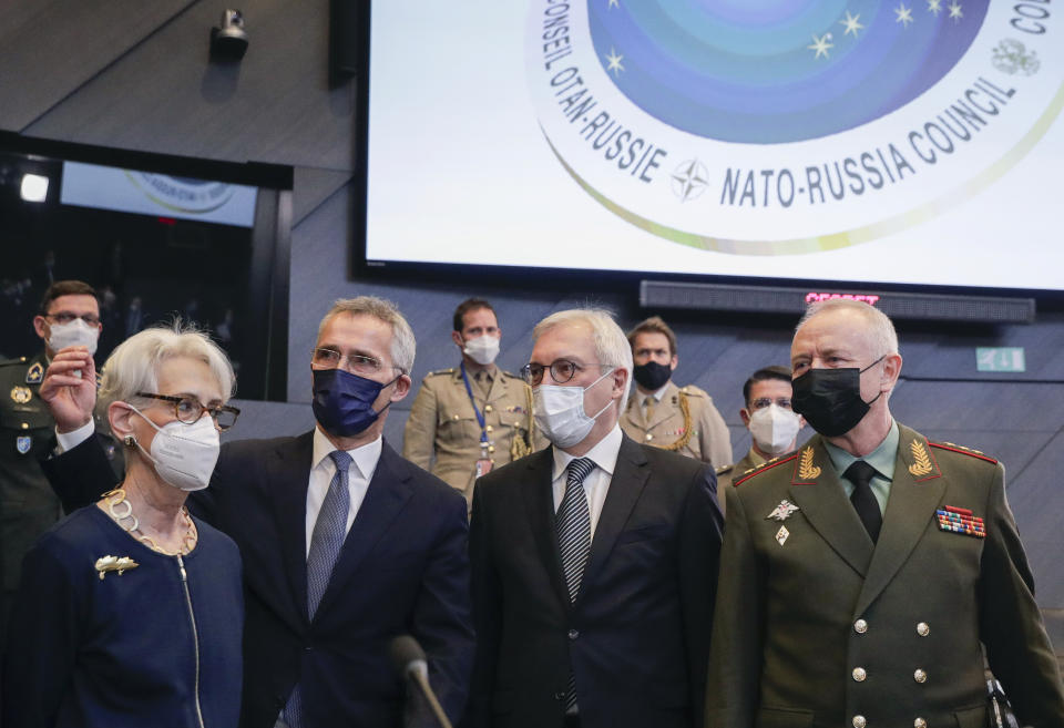 From left, United States Deputy Secretary of State Wendy Sherman, NATO Secretary General Jens Stoltenberg, Russia's Deputy Foreign Minister Alexander Grushko, and Russia's Deputy Defense Minister Alexander Fomin pose for a photo prior to the NATO-Russia Council at NATO headquarters, in Brussels, Wednesday, Jan. 12, 2022. Senior NATO and Russian officials are meeting Wednesday to try to bridge seemingly irreconcilable differences over the future of Ukraine, amid deep skepticism that Russian President Vladimir Putin's security proposals for easing tensions are genuine. (Olivier Hoslet, Pool Photo via AP)