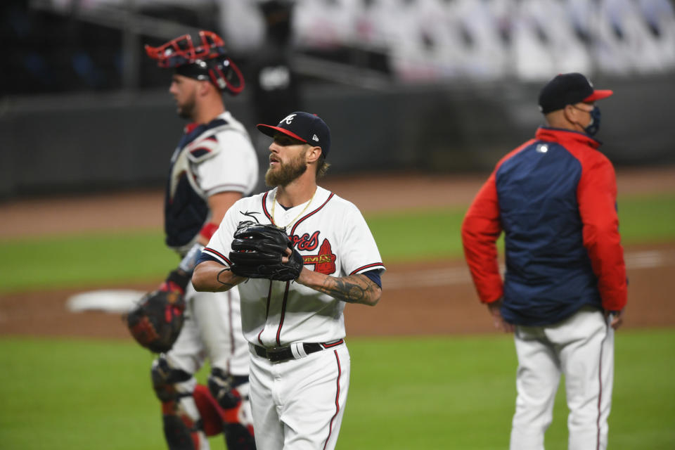 Atlanta Braves pitcher Shane Greene, foreground, is relieved during the eighth inning of a baseball game against the Miami Marlins, Monday, Sept. 21, 2020, in Atlanta. (AP Photo/John Amis)