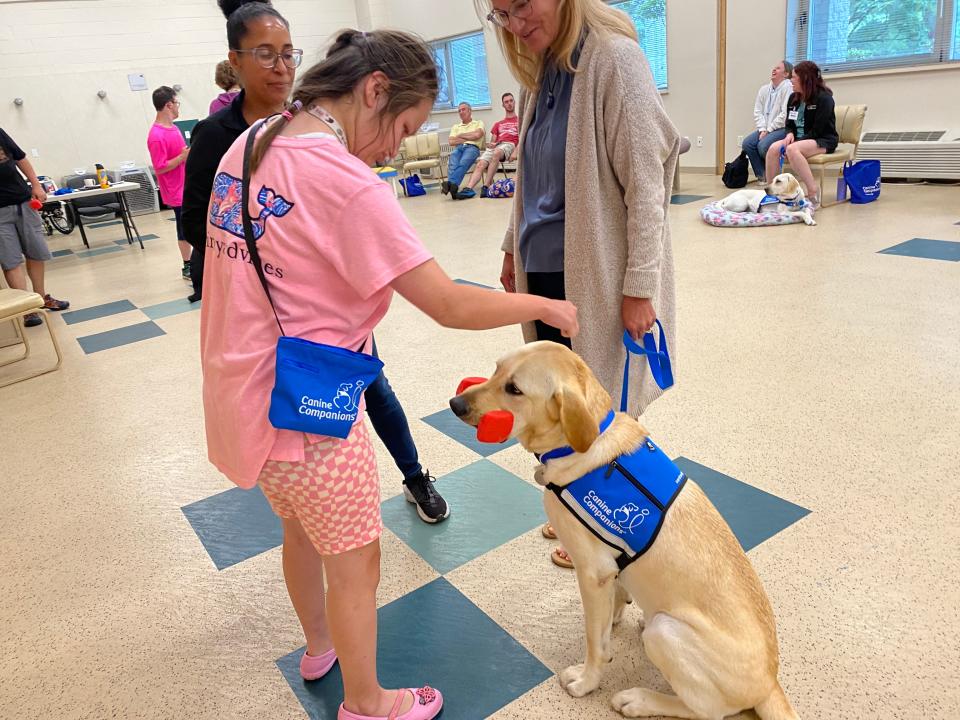 Jazmin Tinsley, 23, of Rehoboth Beach, was born with cerebral palsy, has autism and is nonverbal. Through Canine Companions for Independence, she received her second service dog, Bonus, in August 2023, who helps her navigate physical tasks and improves her confidence.
