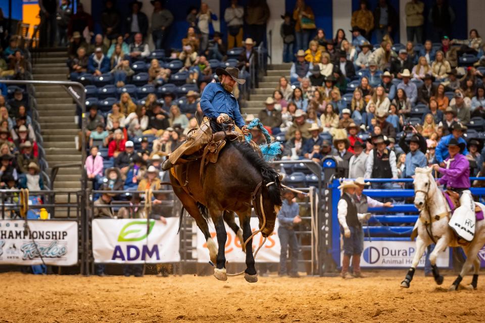 Jacob Lewis of W.T. Waggonner Estate Inc. leads the first go around of the Ranch Bronc Riding with a score of 84 during Thursday's performance of the 2023 WRCA World Championship Ranch Rodeo. The rodeo continues at the Amarillo Civic Center through Sunday.