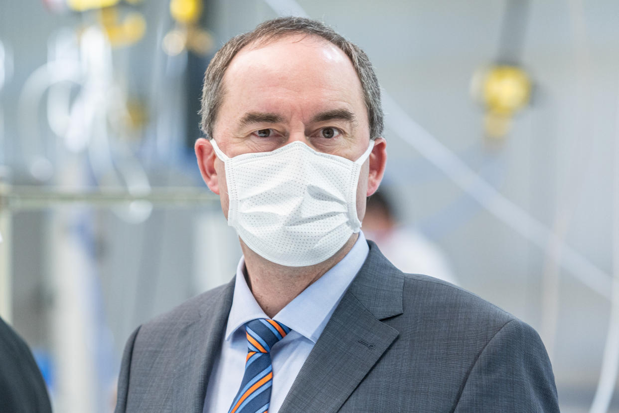 02 April 2020, Bavaria, Weng: Hubert Aiwanger (Independent Voter), Bavaria's Minister of Economic Affairs, stands with a face mask in a production hall of the automotive supplier Zettl. In view of the corona crisis, the company has switched its operations to the production of protective masks. Photo: Armin Weigel/dpa (Photo by Armin Weigel/picture alliance via Getty Images)