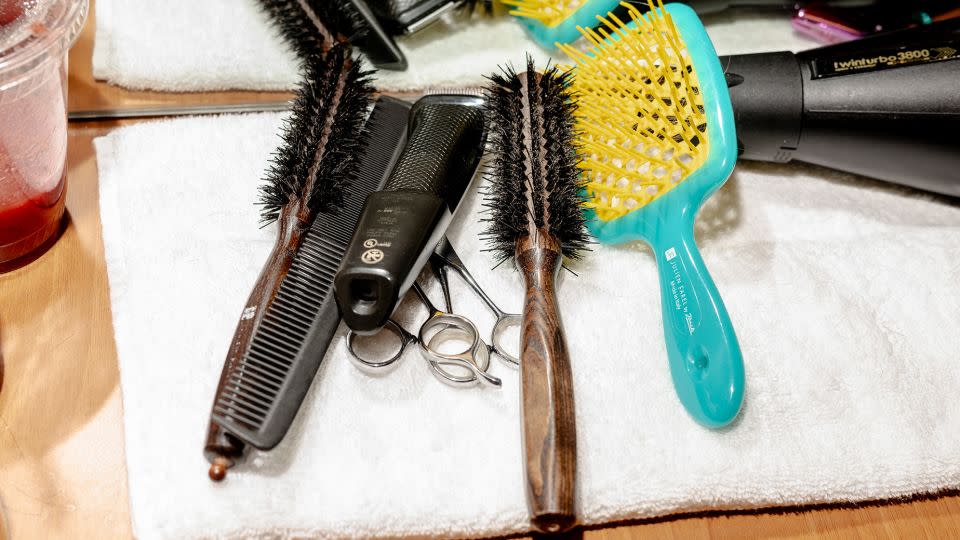 Hair styling tools sit at a station in Julien Farel's pop-up salon inside of Arthur Ashe Stadium in New York on August 30. - Will Lanzoni/CNN