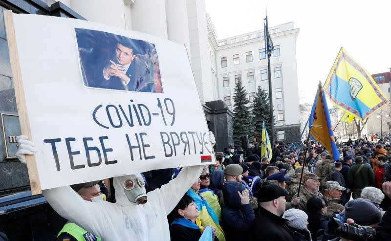 People attend a rally marking the Volunteer Day in Kiev