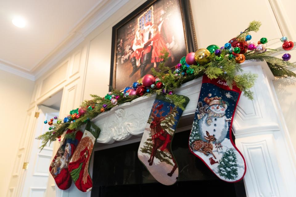 Christmas stockings hang over the fireplace at The Alderson's home for Homes for the Holidays.