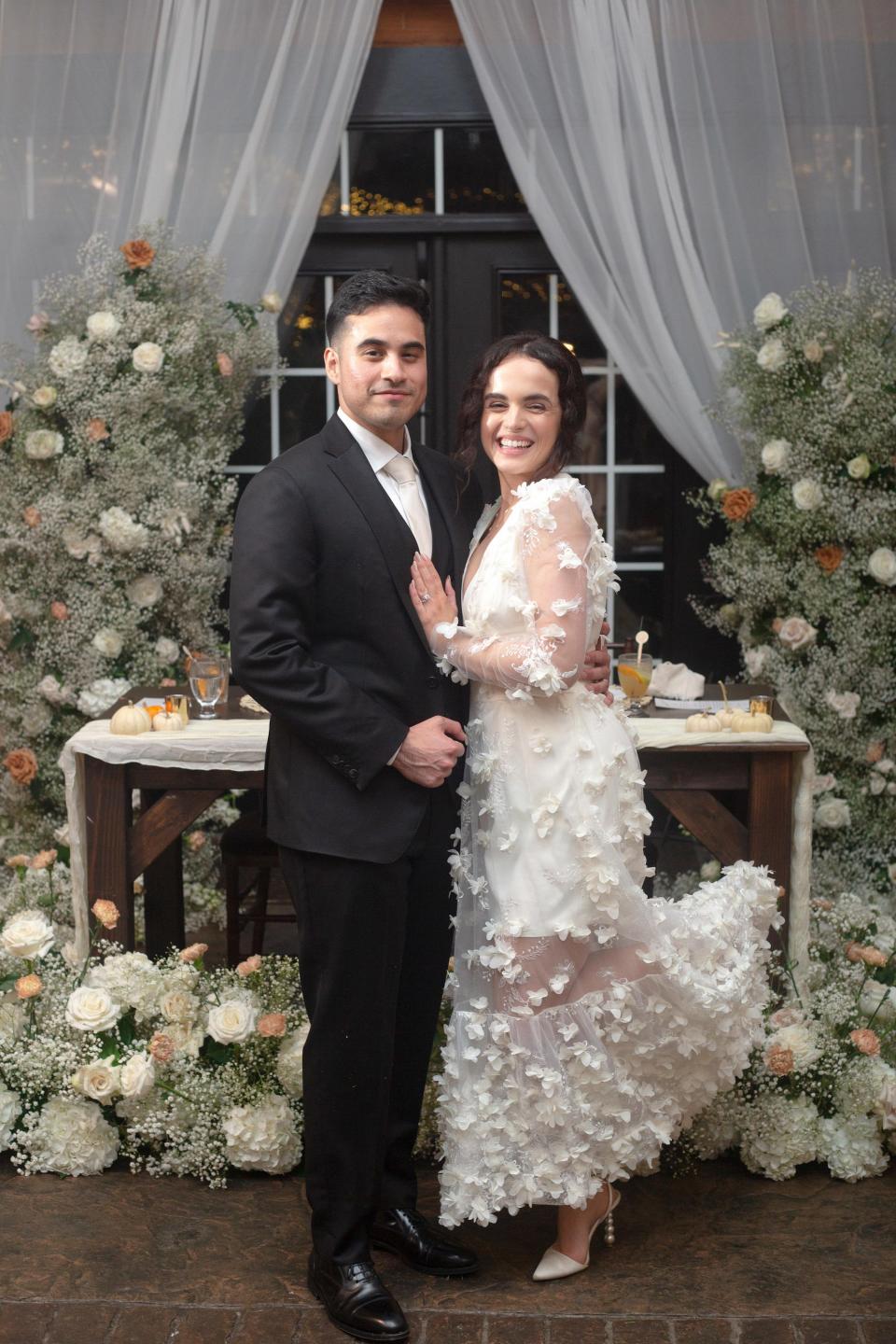 A bride and groom embrace on their wedding day.