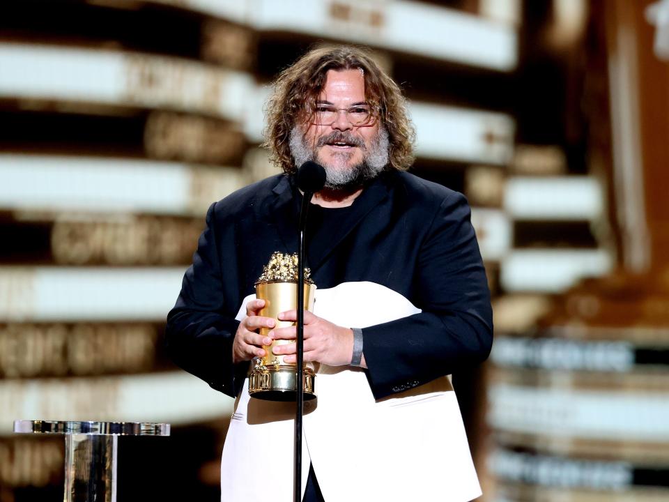 Jack Black accepts the Comedic Genius Award in 2022.