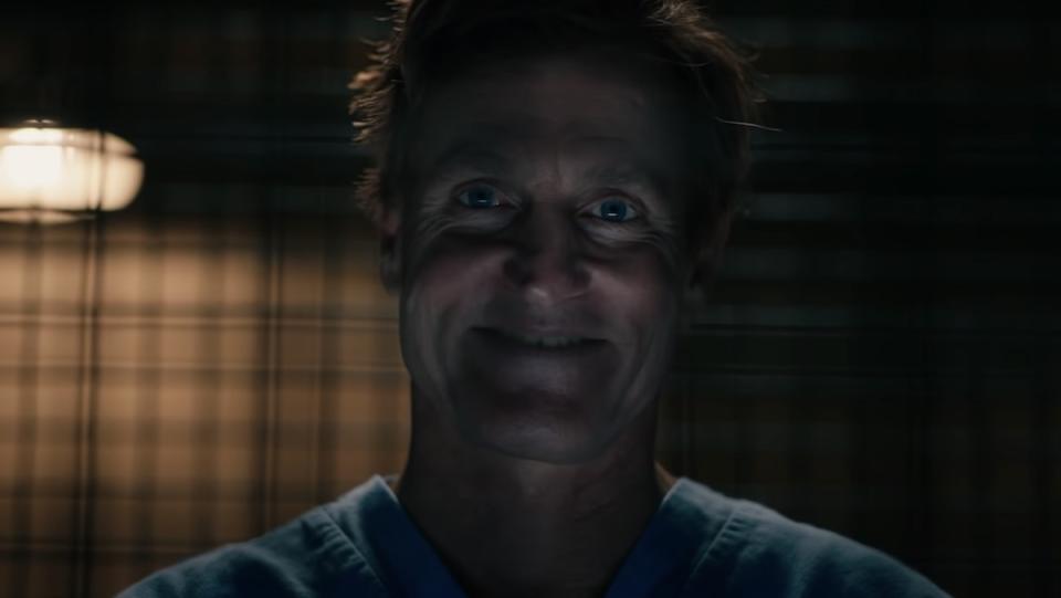 Woody Harrelson smiles behind bars as Cleatus Kasady