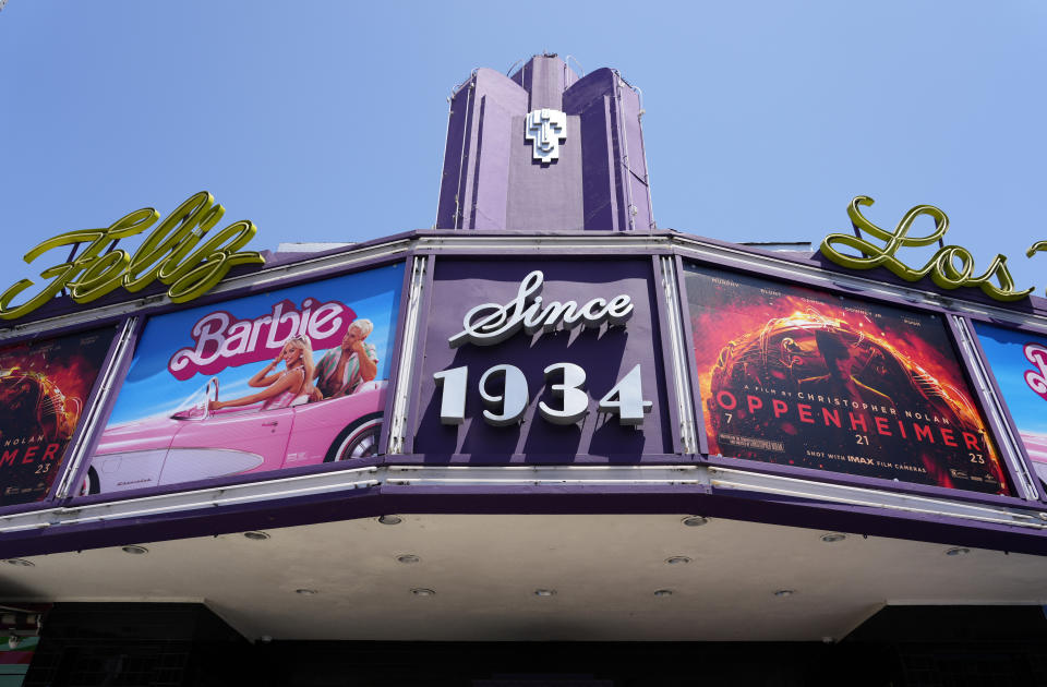 FILE - The marquee of the Los Feliz Theatre features the films "Barbie" and "Oppenheimer," Friday, July 28, 2023, in Los Angeles. Both films were blockbusters in 2023. (AP Photo/Chris Pizzello, File