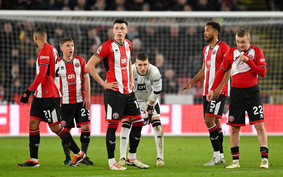 Sheffield United players look on - Sheffield United prepare mass clearout as relegation looms