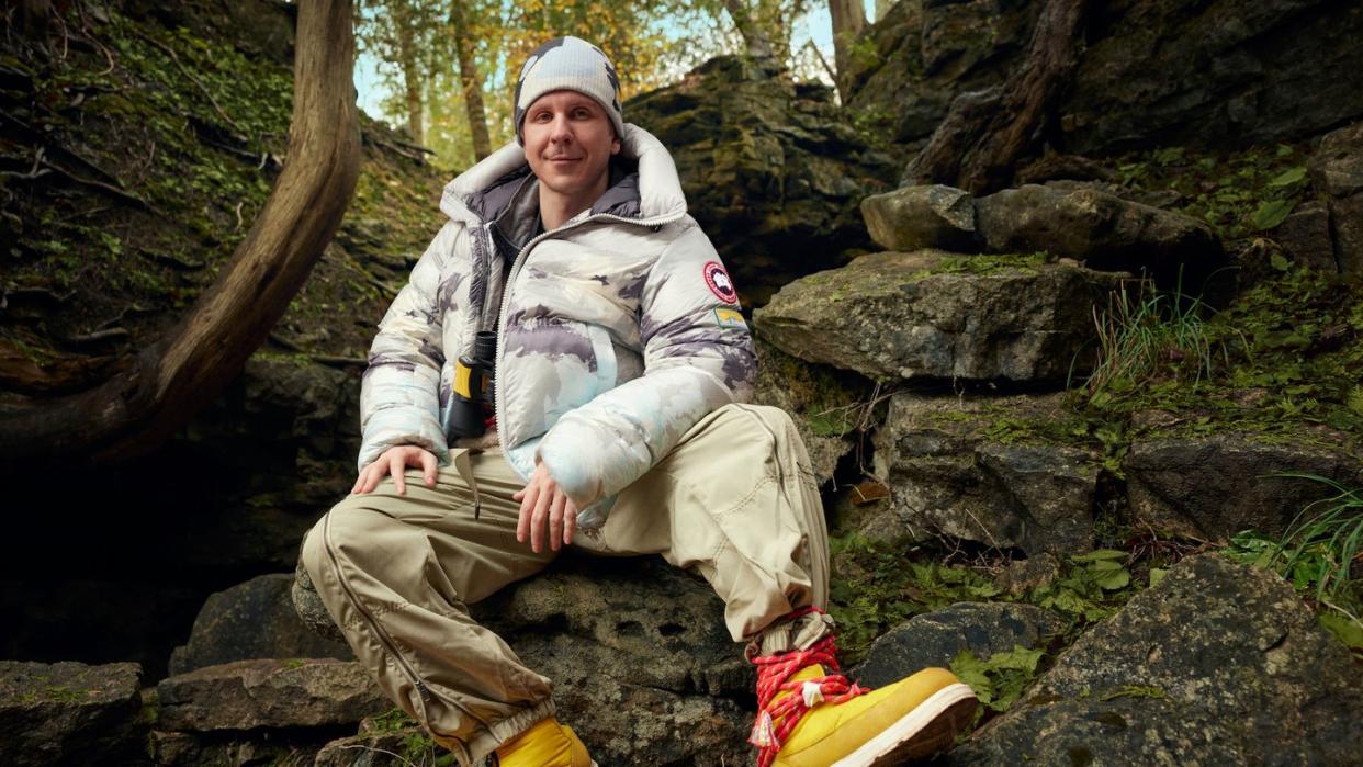 a man sitting on a rock