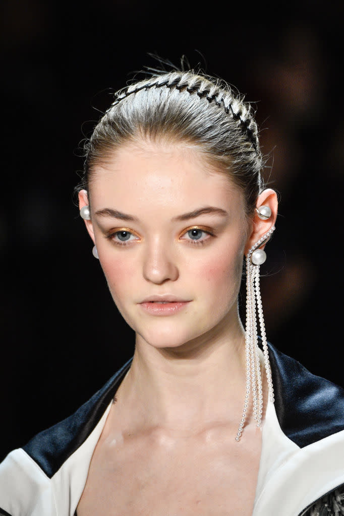 <p>Pearl ear cuff and long strand pearl earring at the Prabal Gurung FW18 show. (Photo: Getty) </p>