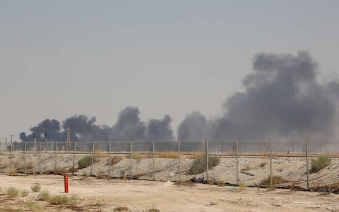 Smoke billows from an Aramco oil facility in Abqaiq about 60km (37 miles) southwest of Dhahran in Saudi Arabia - Credit: &nbsp;AFP