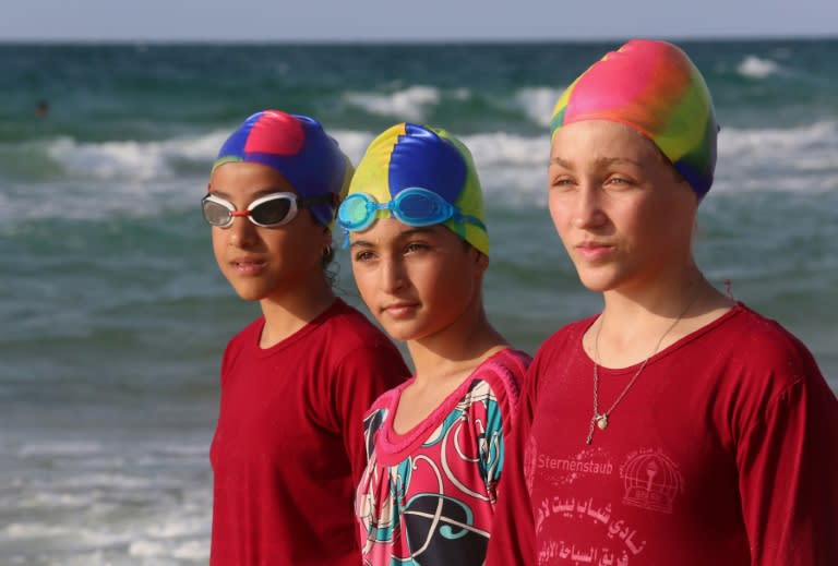 Girls mostly wear long black swim trousers and red blouses for their training sessions at one of the only mixed-sex swimming clubs in the conservative Gaza Strip