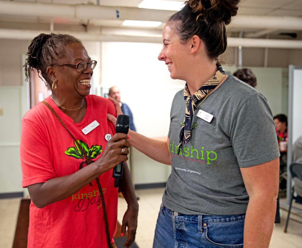 Debra Klepp, left, a volunteer at Kinship Community Food Center and Caitlin Cullen, food center director, converse during a food distribution event Sept. 30, 2023 at St. Casimir Church in Milwaukee's Riverwest neighborhood.